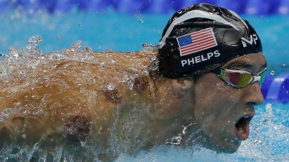 This Michael Phelps Fan Actually Got #PhelpsFace Tattooed On His Leg!