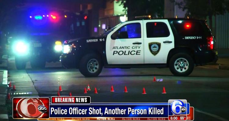 Officer shot after exchange of gunfire; 1 suspect killed